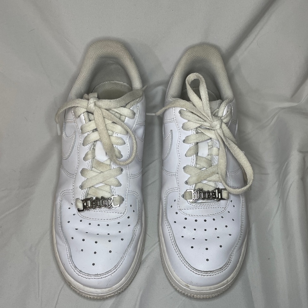 Beat up White Air Force Ones with teddy fresh accent